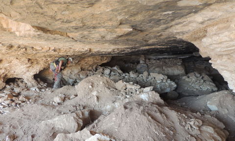 The Cave of the Skulls and the damage inside it; members of the Unit for the Prevention of Antiquities Robbery on their way to the cave