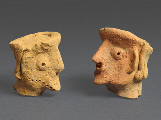 Figurines of a person. Photograph: Clara Amit, courtesy of the Israel Antiquities Authority
