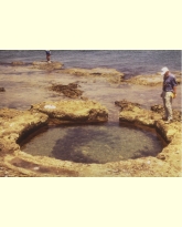 Rock-cut pool at Shiqmona