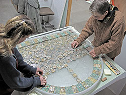 IAA Conservators working on the Glass Panel