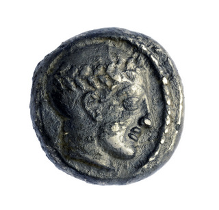 . Coin from the reign of King Antiochus III. Photo: Clara Amit, courtesy of the Israel Antiquities Authority