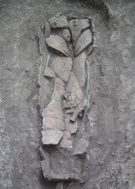 The clay coffin at the time of its discovery in the field. Photograph: Dan Kirzner, courtesy of the Israel Antiquities Authority.
