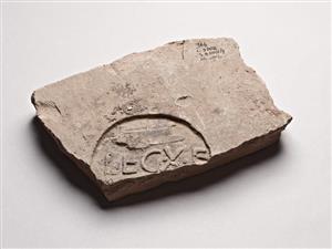 Fragment Roof Tile Impressed with Stamp-Seal Impression 
 Photographer:Meidad Suchowolski