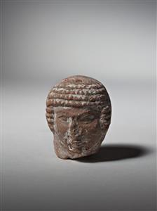 Head Pillar figurine   
 Photographer:Meidad Suchowolski