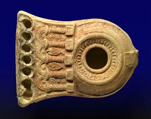 Multi-Wickhole Lamp Decorated in Relief
Photographer:Clara Amit