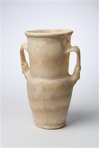 Small Jar Decorated with Animal Heads 
 Photographer:Meidad Suchowolski